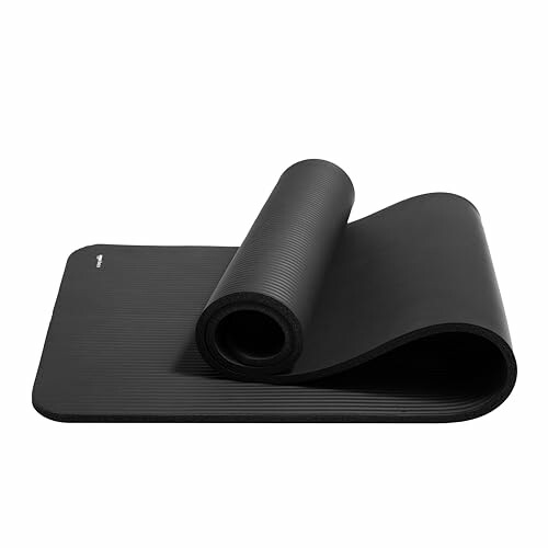 Rolled black yoga mat