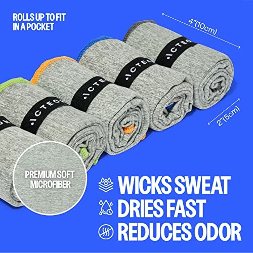 Compact gray microfiber towels rolled, highlighting sweat-wicking and odor-reducing features.