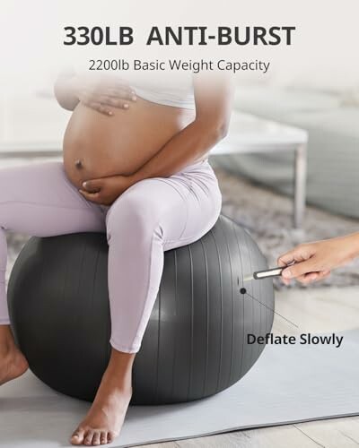 Pregnant woman sitting on anti-burst exercise ball.